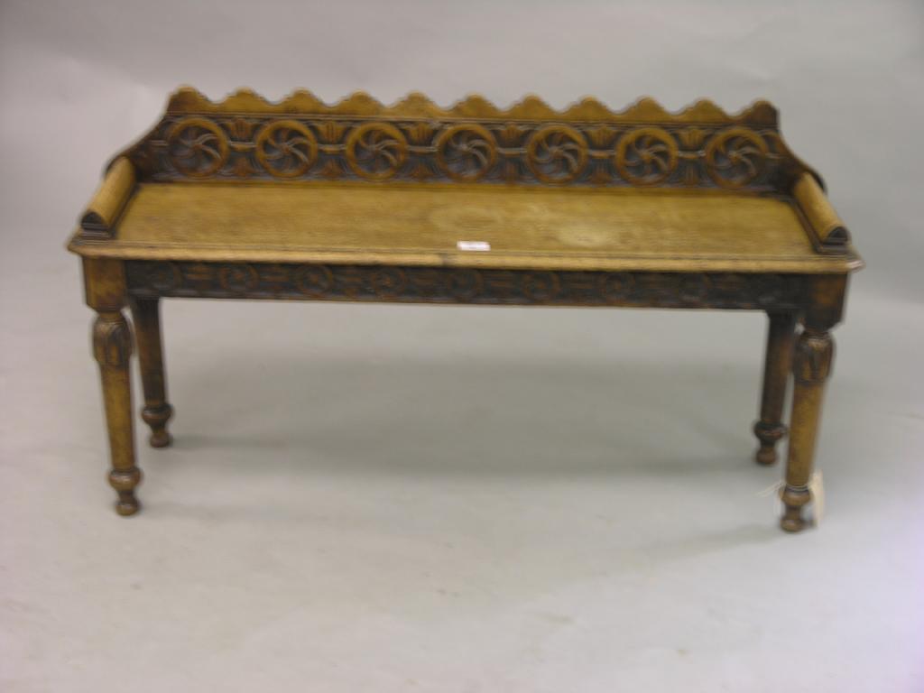 Appraisal: A late Victorian oak window seat with carved back similarly