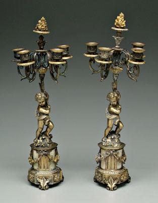 Appraisal: Pair cast brass cherub candelabra each with four cups below