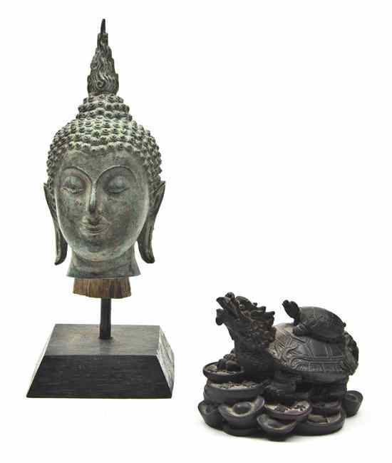 Appraisal: A Southeast Asian Bronze Head of Buddha depicted with a