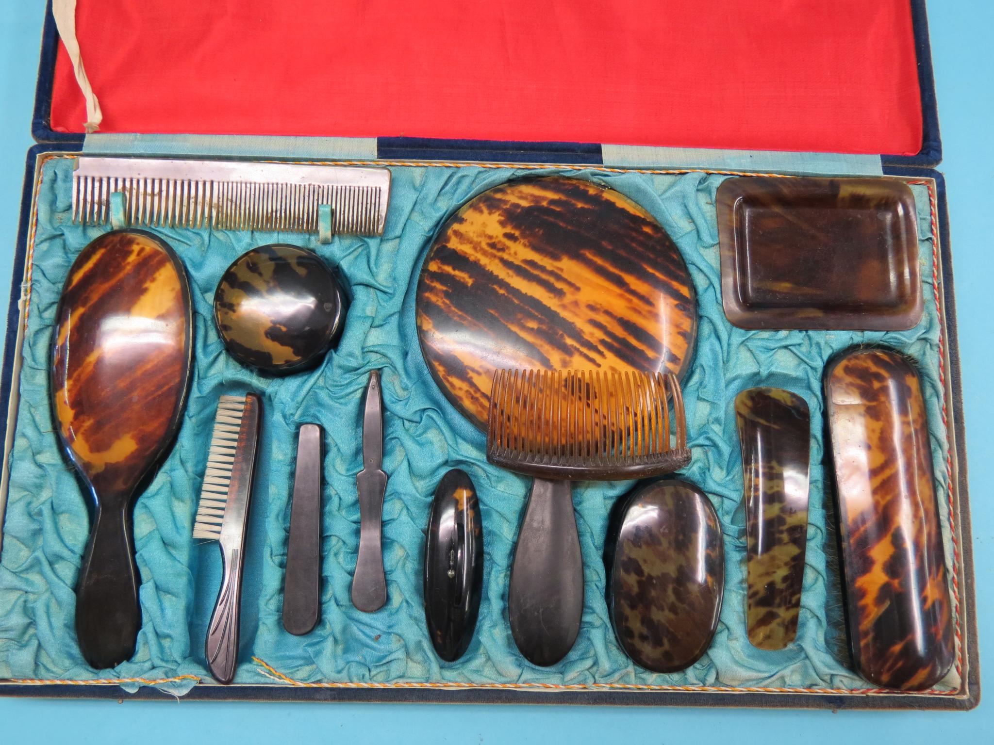 Appraisal: A tortoiseshell-effect dressing set thirteen pieces contained within original fitted