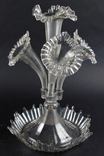 Appraisal: A CLEAR PATTERN GLASS FLOWER EPERGNE the pinched and ruffled