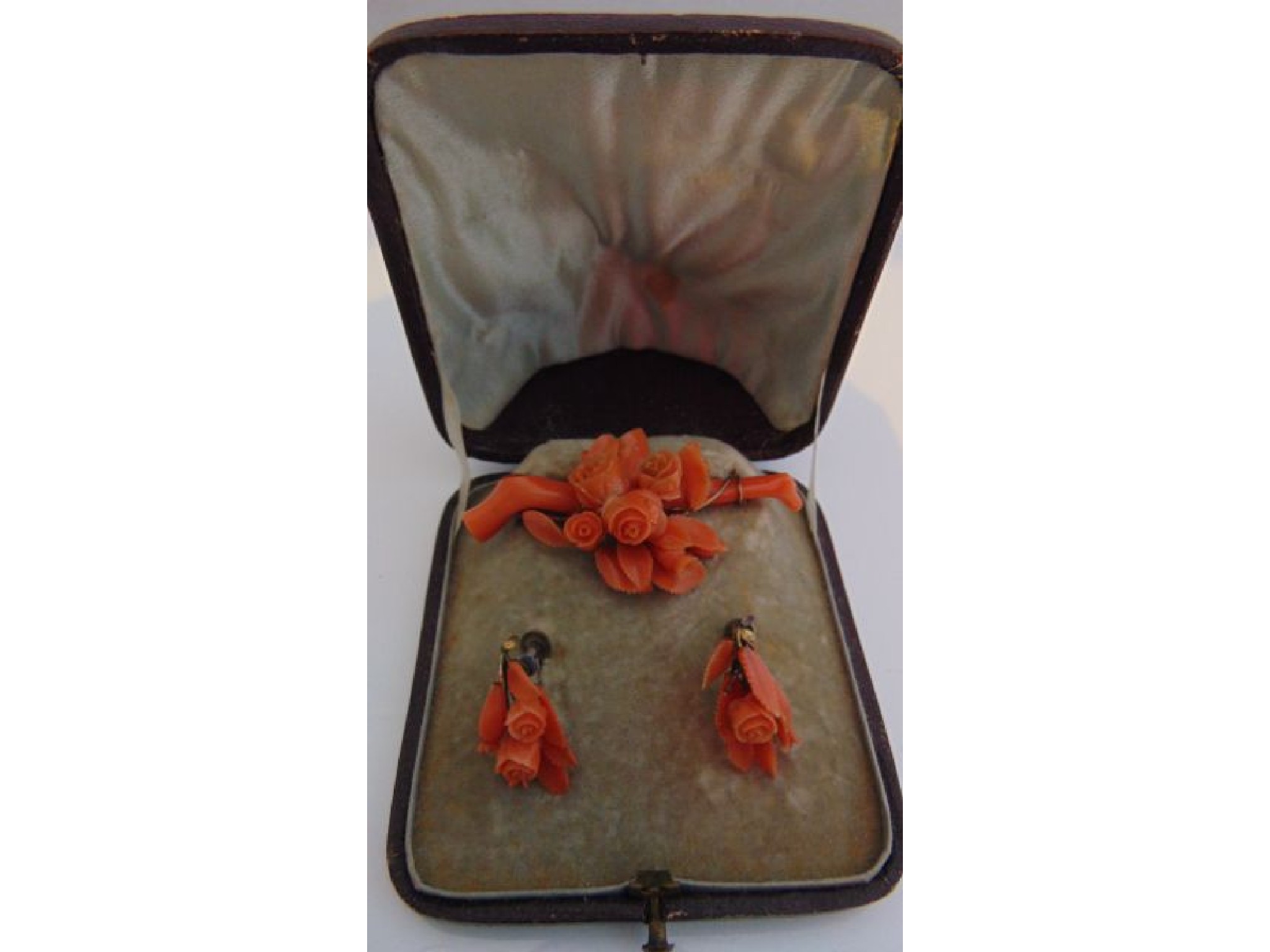 Appraisal: A cased Victorian coral demi-parure comprising a brooch and a