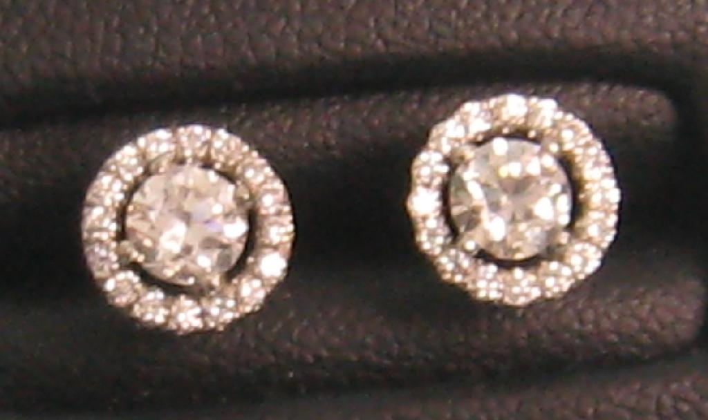 Appraisal: A pair of Diamond Ear Studs each with central claw-set