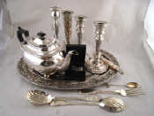 Appraisal: Silver plate A barge shaped teapot on ball feet a