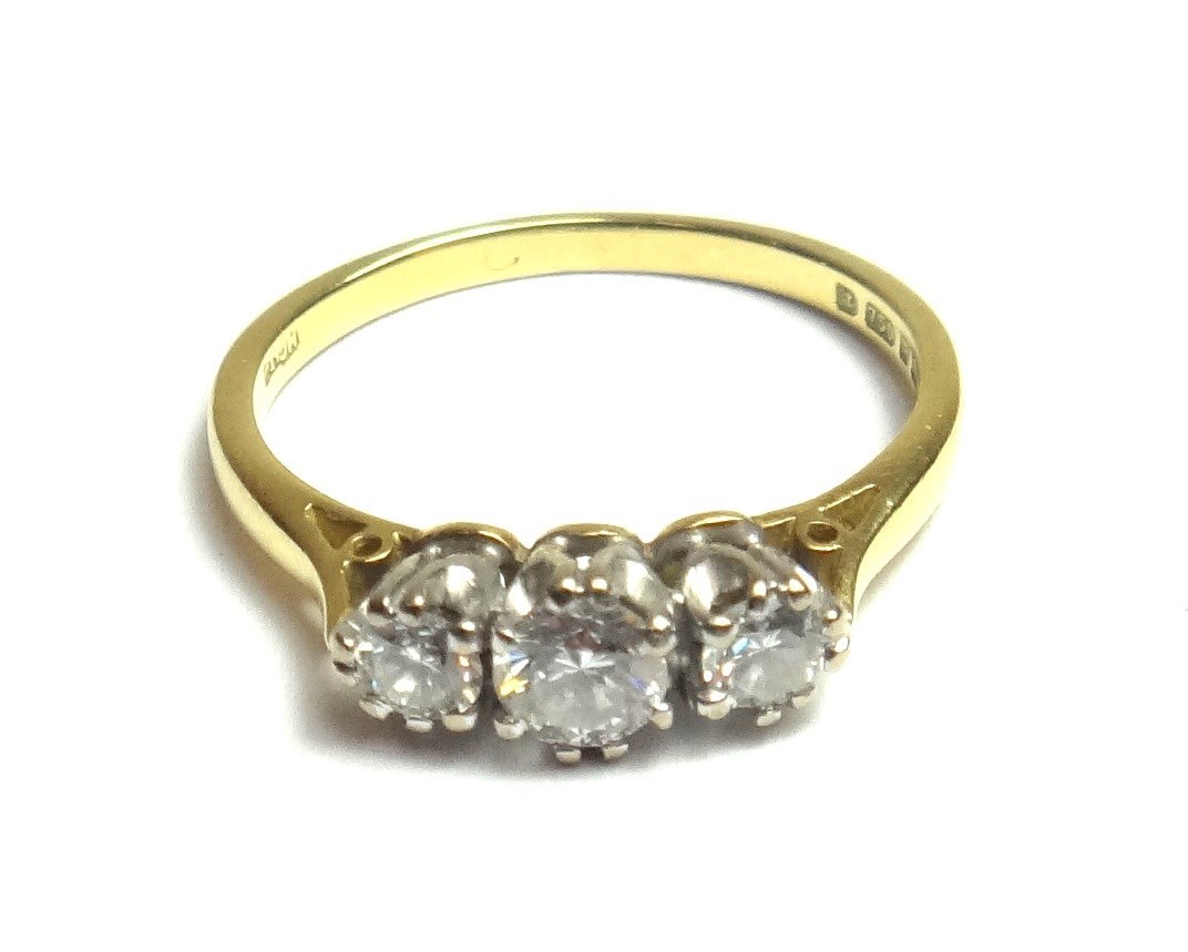 Appraisal: An ct gold and diamond set three stone ring claw