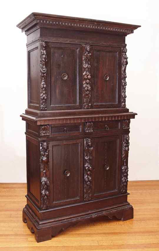 Appraisal: MID TH CENTURY ITALIAN CARVED WALNUT CABINET Two part cabinet