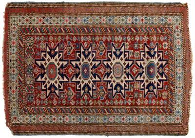 Appraisal: Caucasian rug central panel with repeating geometric designs on ivory