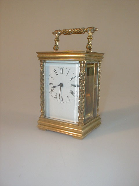 Appraisal: An early thC gilt brass carriage timepiece white enamel dial