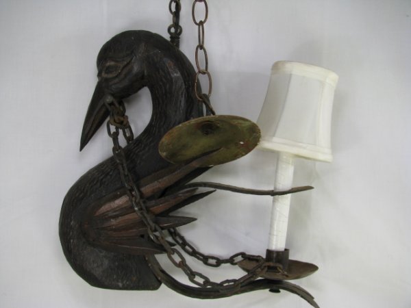 Appraisal: Folk art hanging light fixture carved swan bust with one