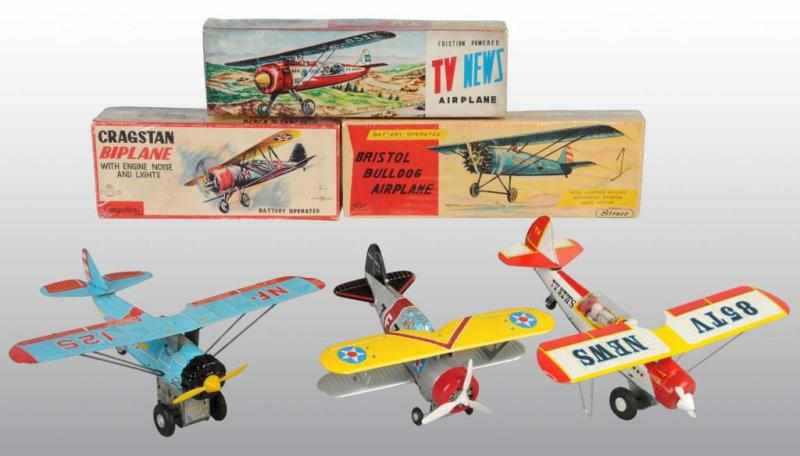 Appraisal: Lot of Tin Early-Style Airplane Toys Description Japanese Working Includes