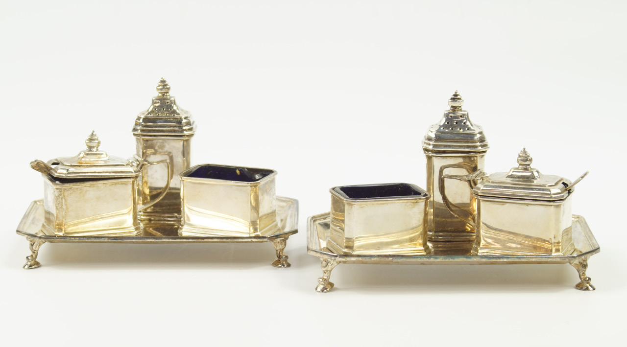 Appraisal: A near pair of George V silver condiment sets on