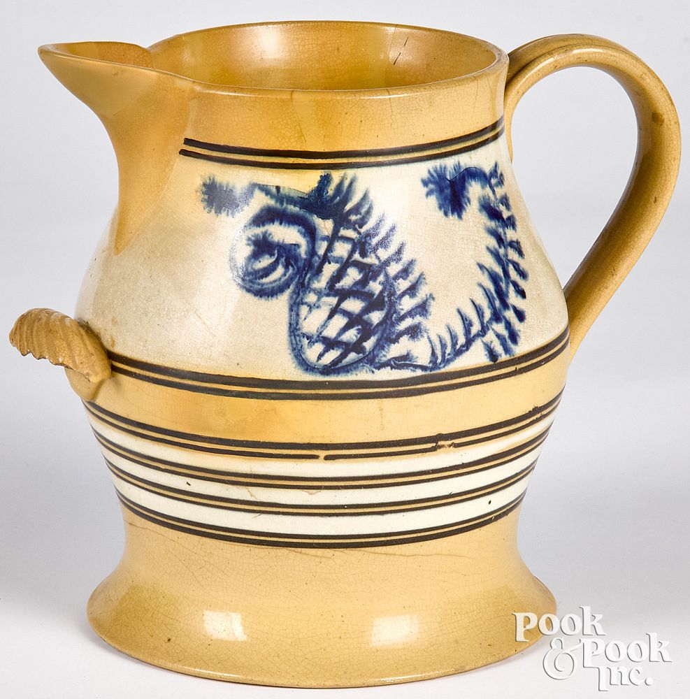 Appraisal: Large yellowware pitcher Large yellowware pitcher with mocha seaweed decoration