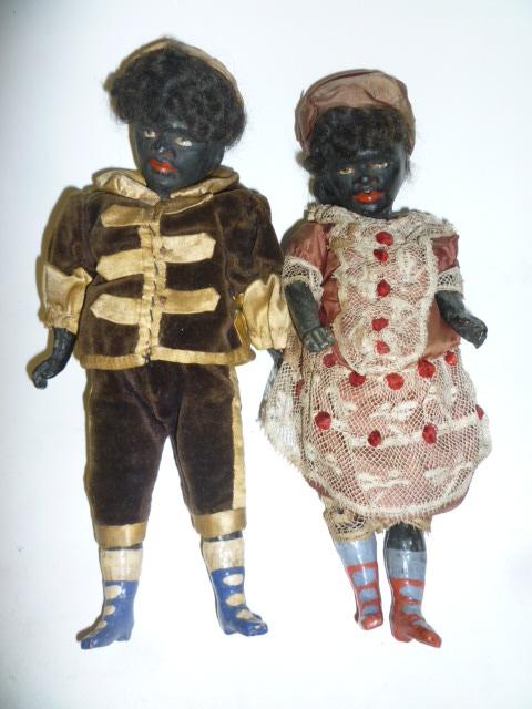 Appraisal: A pair of composition blackamoor dolls male and female with