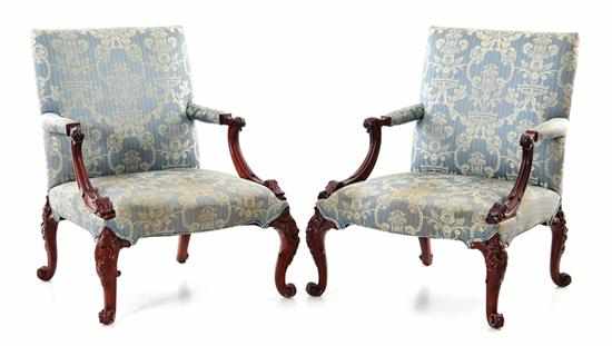 Appraisal: Pair George II style carved mahogany library open armchairs th