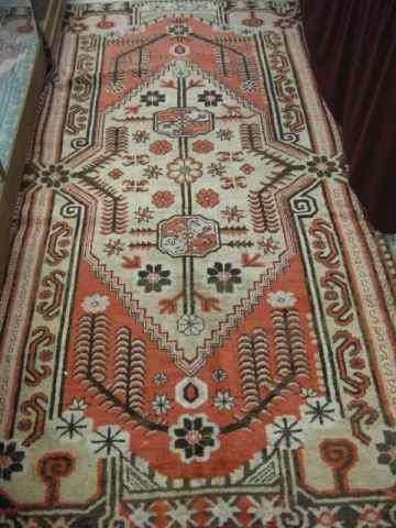 Appraisal: Oushak Persian Handmade Rug stylizedflorals primarily browns ivory soft reds