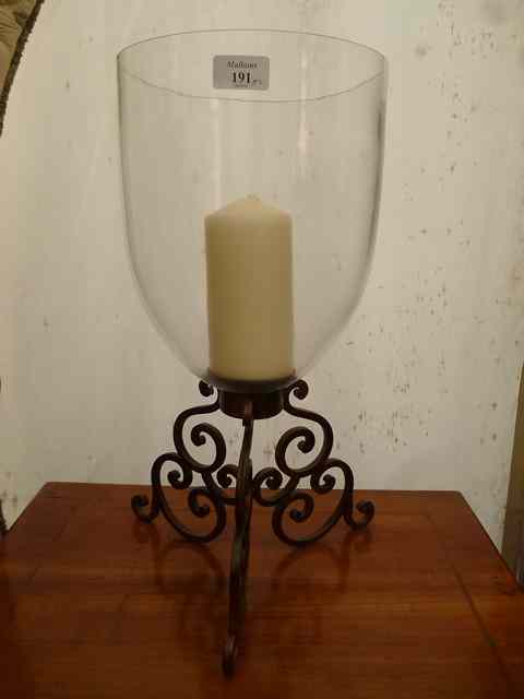 Appraisal: A PAIR OF GLASS CANDLE LANTERNS on scrolling wrought iron