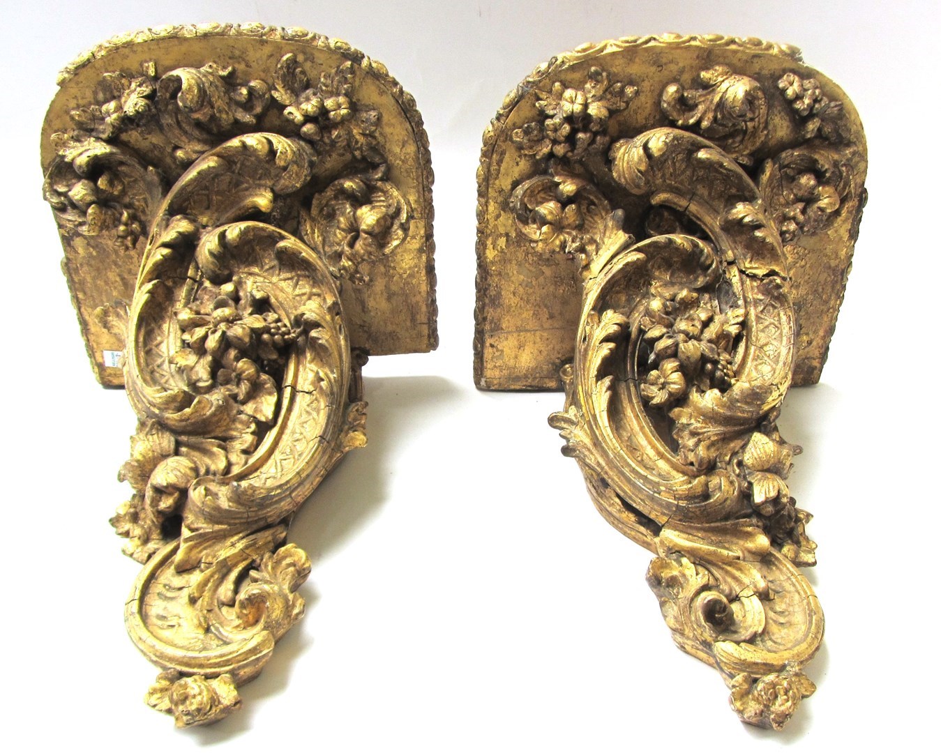 Appraisal: A pair of Victorian gilt wall brackets with floral opposing