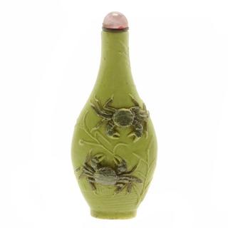 Appraisal: A Green Biscuit-Glazed Snuff Bottle Of flattened baluster form molded