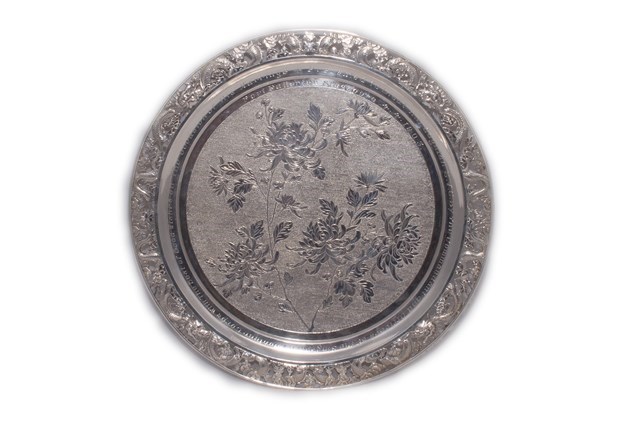 Appraisal: An Oriental circular salver decorated with a floral spray to