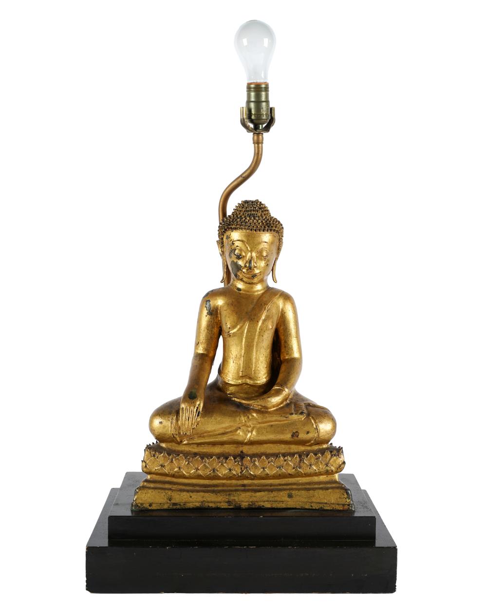 Appraisal: GILTWOOD SEATED BUDDHA FIGUREmounted as a lamp on a tiered