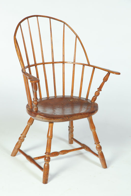 Appraisal: SACK-BACK WINDSOR ARMCHAIR American late th-early th century mixed woods