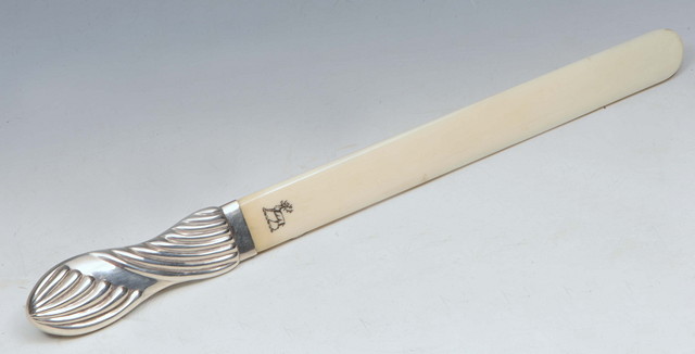 Appraisal: A SILVER MOUNTED IVORY PAGE TURNER handle with wrythen design