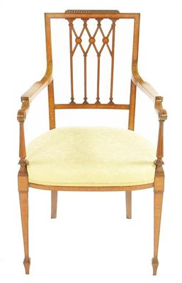 Appraisal: A late Victorian mahogany and satinwood elbow chair with a