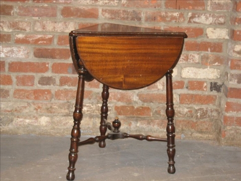 Appraisal: VICTORIAN STYLE MAHOGANY HANDKERCHIEF TABLE th c the triangular top