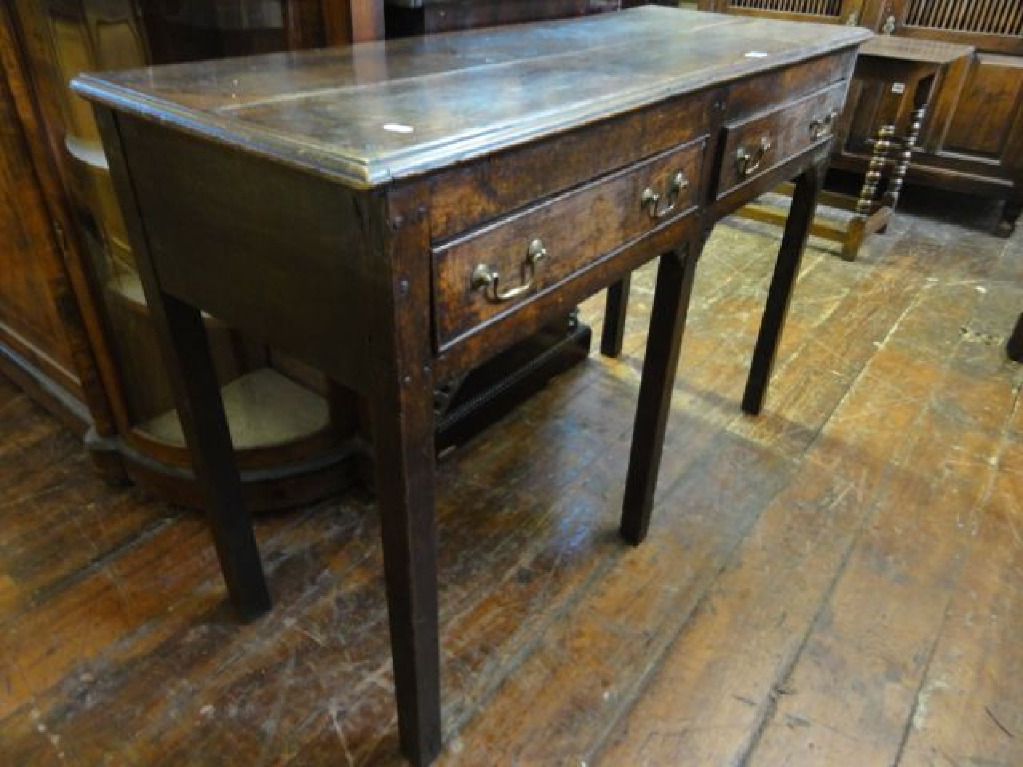 Appraisal: A Georgian oak side table fitted with two frieze drawers