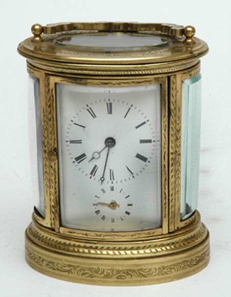 Appraisal: A FRENCH BRASS OVAL CARRIAGE CLOCK th Century Having an