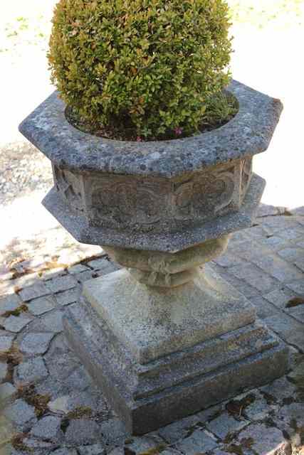 Appraisal: A PAIR OF HADDONSTONE OCTAGONAL GOTHIC STYLE GARDEN URNS each