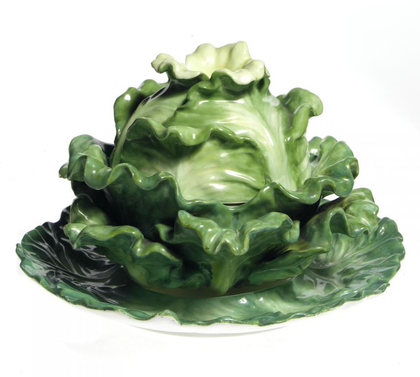 Appraisal: A STAFFORDSHIRE CABBAGE SHAPED BOX COVER AND STAND realistically modelled