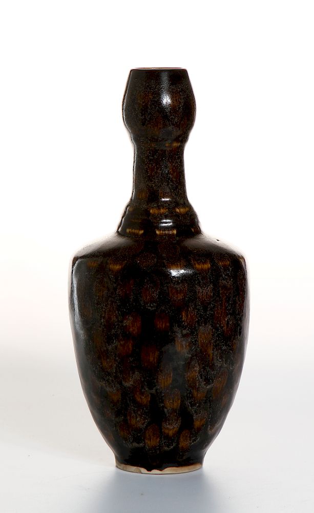 Appraisal: Chinese Russet-Splashed Black Garlic-Mouth Vase The slightly round sides rising