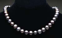 Appraisal: BLACK PEARL NECKLACE Beautiful pearl necklace is made up of