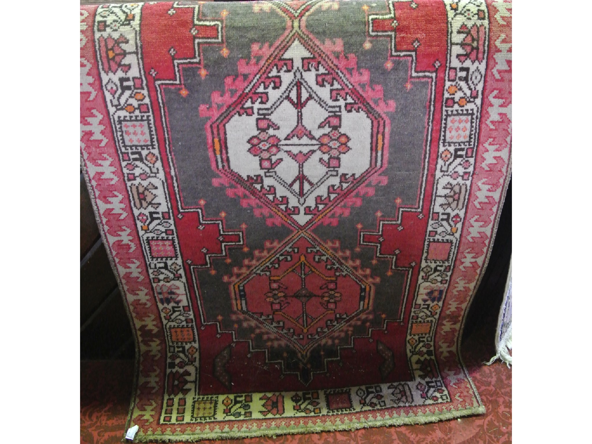 Appraisal: An eastern woven wool runner in the Persian manner the