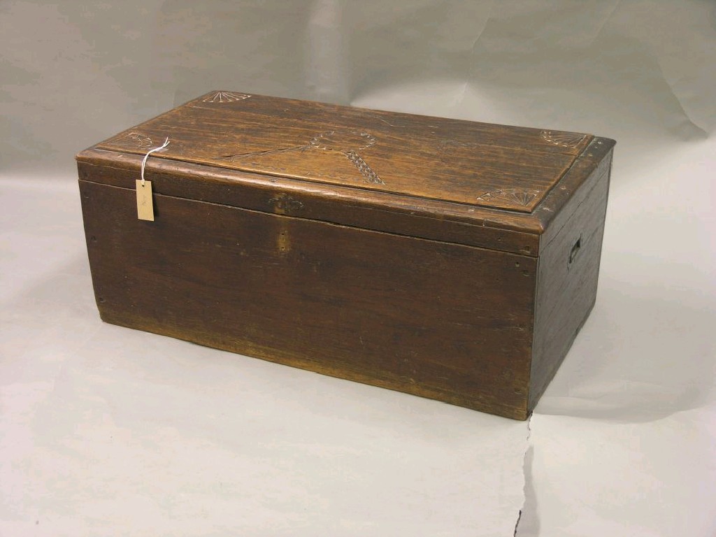 Appraisal: A cedar wood trunk the top with chip-carved detail carrying