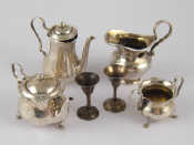 Appraisal: A three piece miniature tea and coffee set comprising teapot