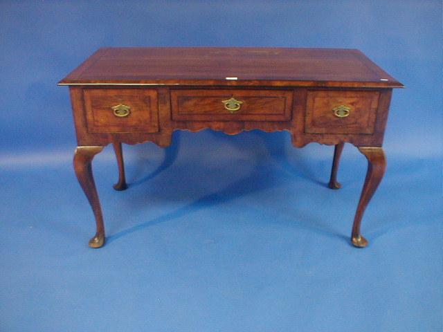 Appraisal: A Queen Anne style three drawer side table with cross