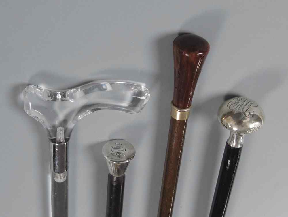 Appraisal: COLLECTION OF WALKING STICKS To include Lucite cane missing tip