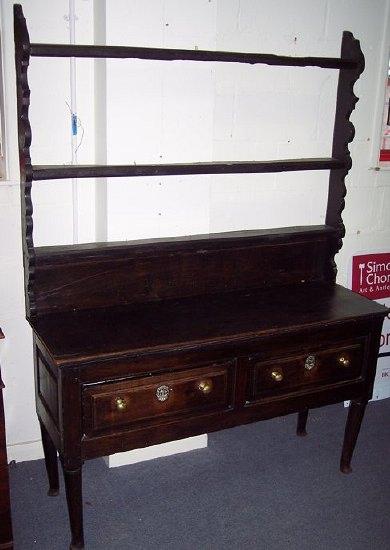 Appraisal: A th Century oak dresser with rack above two drawers