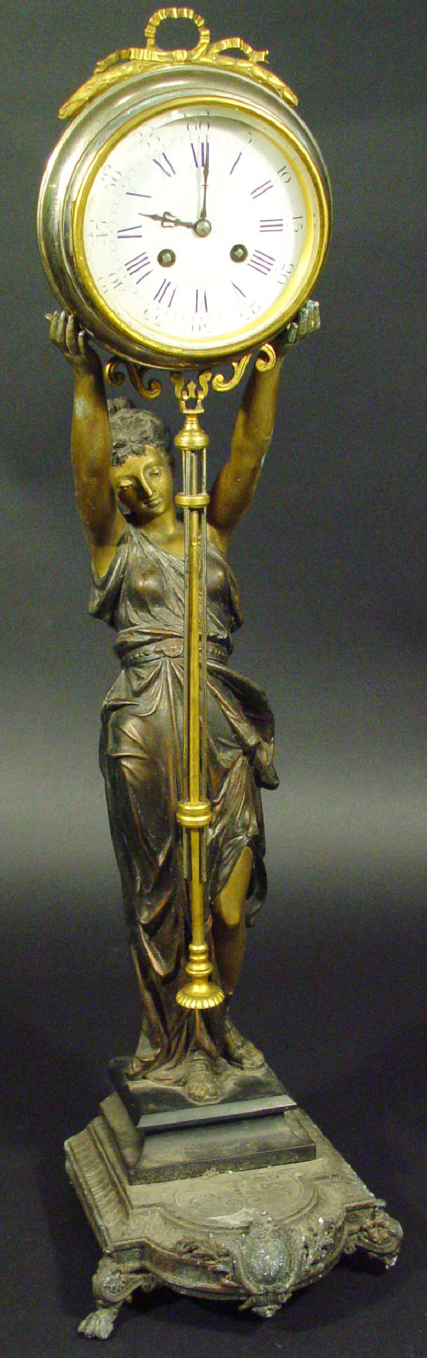 Appraisal: Victorian spelter figural clock the robed female supporting circular movement