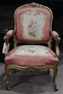 Appraisal: French Louis XV style giltwood fauteuil having a carved crest