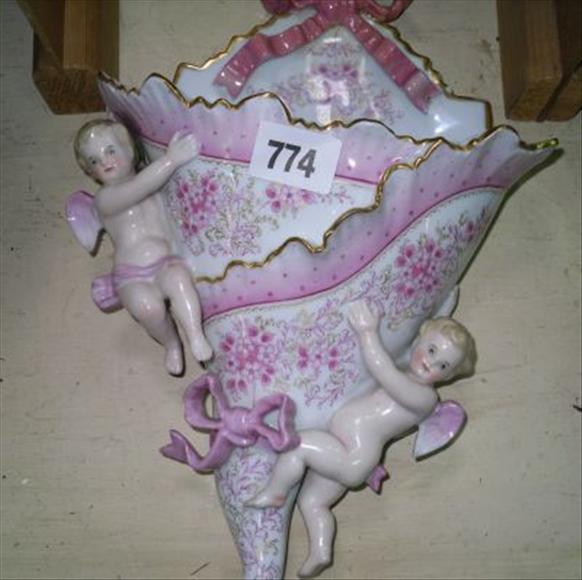 Appraisal: A pair of white and pink glazed German cherubic porcelain