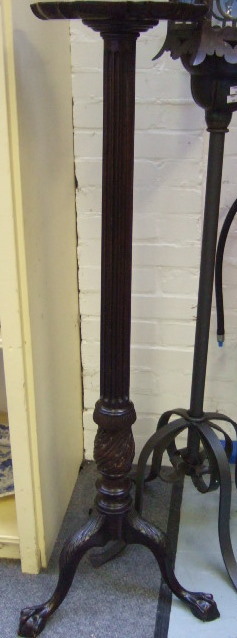 Appraisal: A th century torchere the shaped top raised on fluted