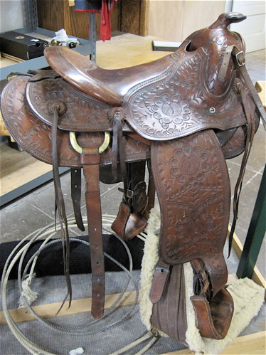 Appraisal: MACPHERSON WESTERN SADDLE hand tooled leather saddle seat leather covered