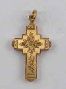 Appraisal: A yellow metal tests ct gold cross pendant marked x