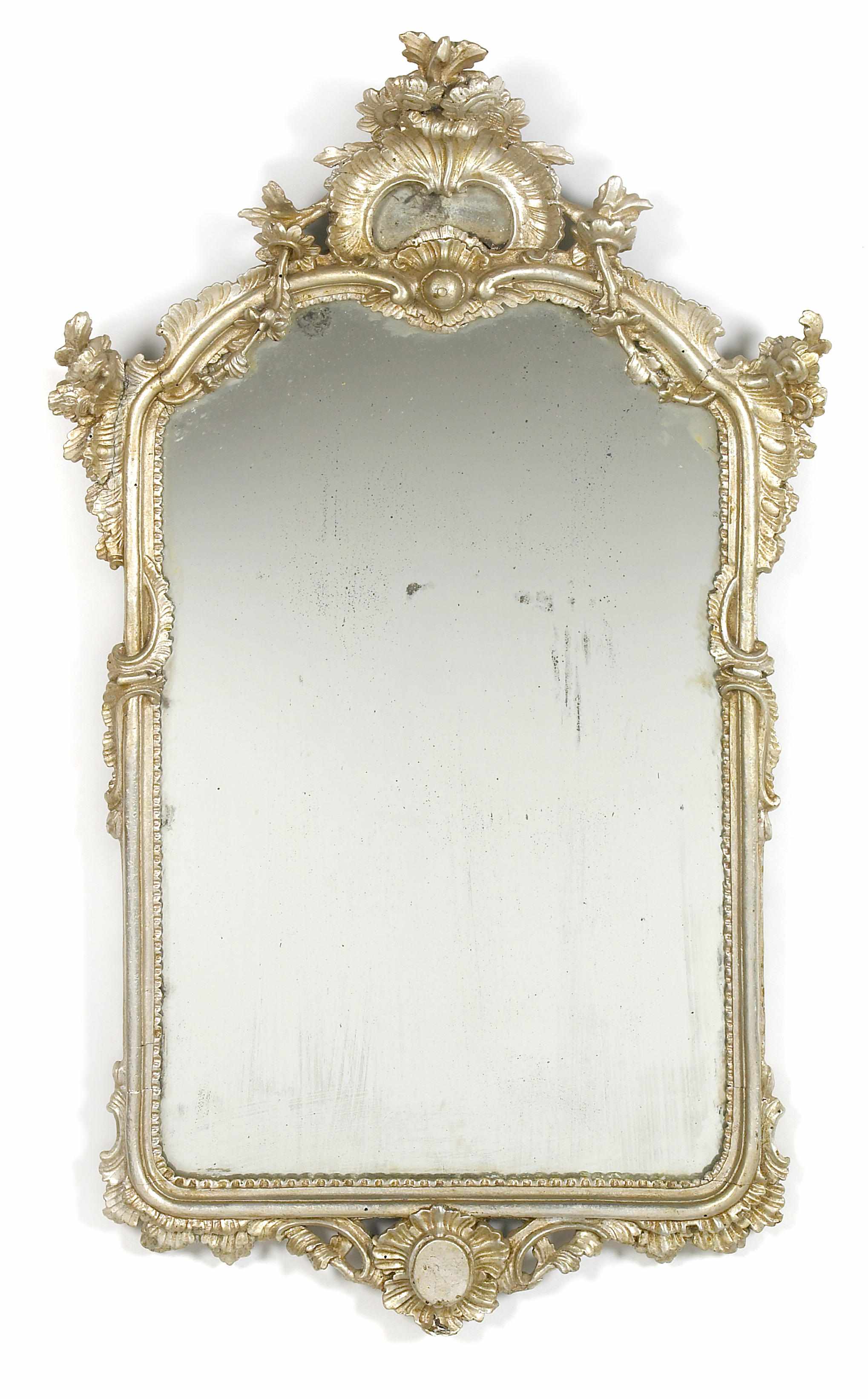 Appraisal: An Italian Rococo carved silvered wood mirror third quarter th