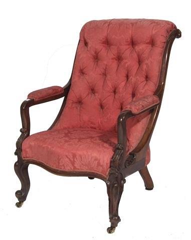 Appraisal: A VICTORIAN ROSEWOOD ARMCHAIR with carved scroll back deep button