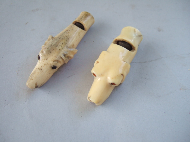 Appraisal: An ivory hunting whistle modelled as a hounds head th