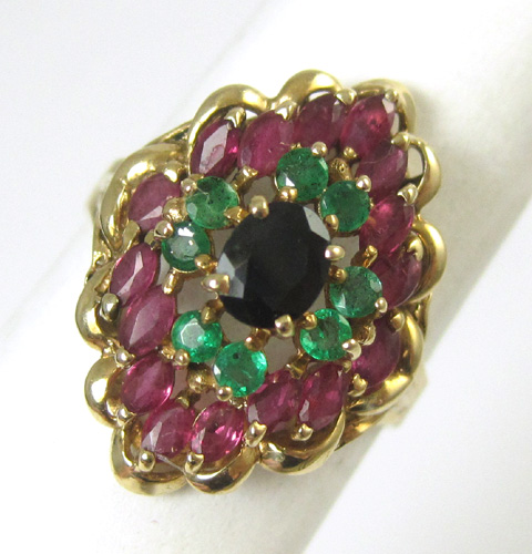 Appraisal: SAPPHIRE EMERALD AND RUBY RING k yellow gold centering an